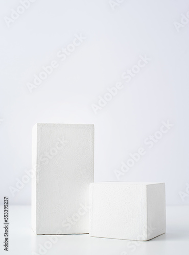 Valokuva A minimalistic scene of a gypsum podium on white background, for natural cosmeti