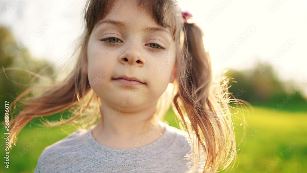 people in the park. portrait little girl outdoors. happy family kid dream concept. child a girl kid sun portrait close-up in sun the park glare. happy cute baby in summer outdoors close up portrait people in the park. portrait little girl outdoors. happy family kid dream concept. child a girl kid sun portrait close-up in sun the park glare. happy cute baby in summer outdoors close up portrait