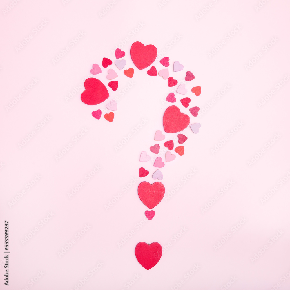 Question symbol made from hearts on a pink background. Marriage proposal symbol. The concept of love and romance. Square photo