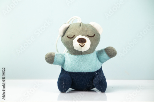 little teddy bear sleeping on white background