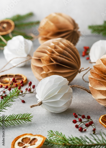 Handmade Christmas Honeycomb ball made from white und brown coffee filter. Scandinavian Nordic Craft Paper concept. Selective focus.