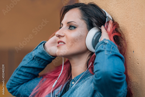 urban woman with headphones on the street