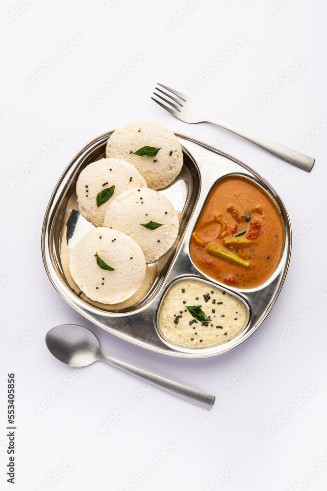 Idly sambar or Idli with Sambhar and green, red chutney. Popular South indian breakfast