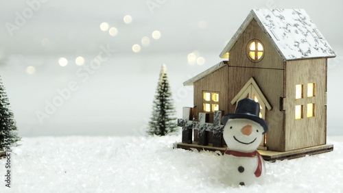 Merry Christmas background with snow, colorful bokeh backdrop.