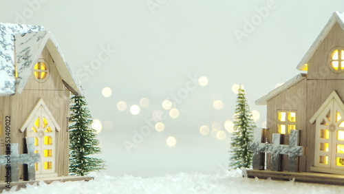 Merry Christmas background with snow, colorful bokeh backdrop.
