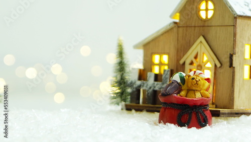 Merry Christmas background with snow, colorful bokeh backdrop.