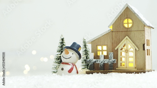 Merry Christmas background with snow, colorful bokeh backdrop.