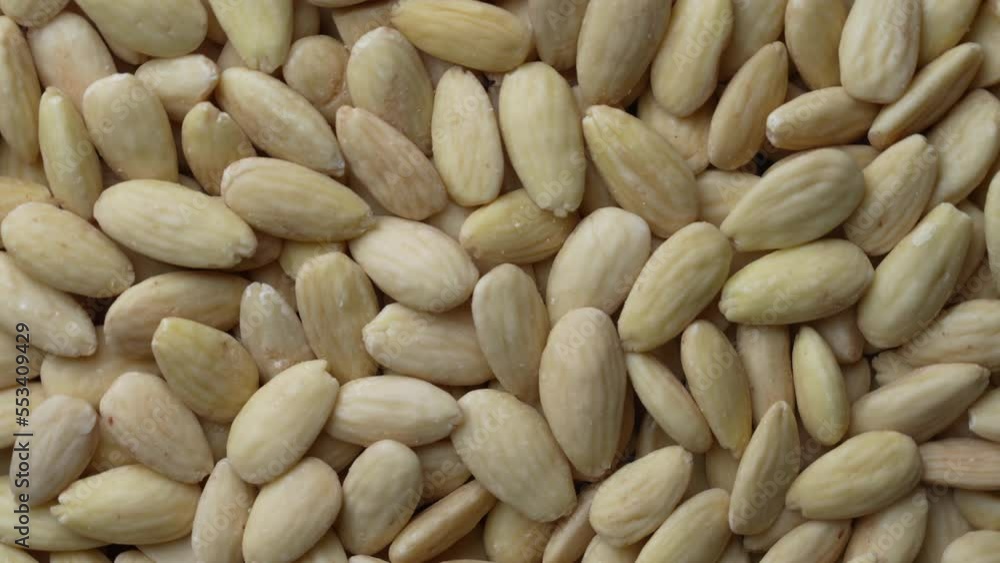 Pile almonds kernels nuts, close up , top view, rotate. Whole nut kernels Pile almonds kernels nuts, close up , top view, rotate. Whole nut kernels