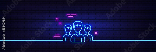Neon light glow effect. Group line icon. Users or Teamwork sign. Male Person silhouette symbol. 3d line neon glow icon. Brick wall banner. Group outline. Vector