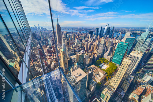 Glass floor high up over nothing in New York City looking out at city