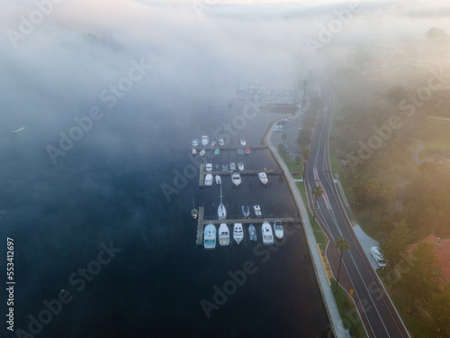A Foggy morning at Fremantle road and rail bridges  Misty swan river from above. 