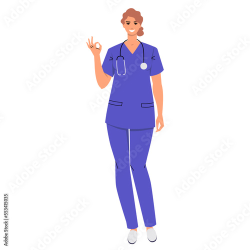 A nurse with a stethoscope shows Ok. The smiling doctor gestures that everything is fine and perfect. Woman wearing scrubs isolated on white. Flat style. Vector.