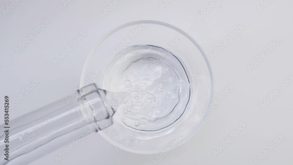 A glass of water. View from above. Pouring water. Glassware. Sterile. Freshness. To quench thirst. Environment. A glass of water. View from above. Pouring water. Glassware. Sterile. Freshness. To quench thirst. Environment.