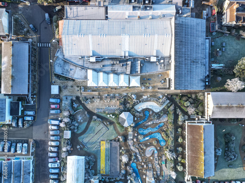 Drone view of a large holiday complex seen on a frosty morning during mid winter. The outdoor recreation area and large restaurant area can be seen. © Nick Beer
