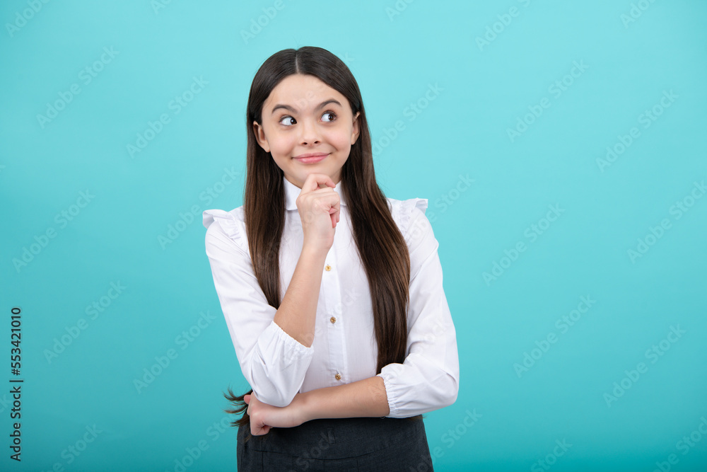 Thinking teenager girl, thoughtful emotion. Emotional portrait of caucasian teenager child girl isolated on studio blue background. Thinking teenager girl, thoughtful emotion. Emotional portrait of caucasian teenager child girl isolated on studio blue background.