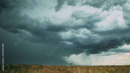 Storm Cloudy Rainy Sky. Dramatic Sky With Dark Clouds In Rainy Day. Storm And Rain Above Summer Field.     . 4K. Agricultural And Weather Forecast Concept.