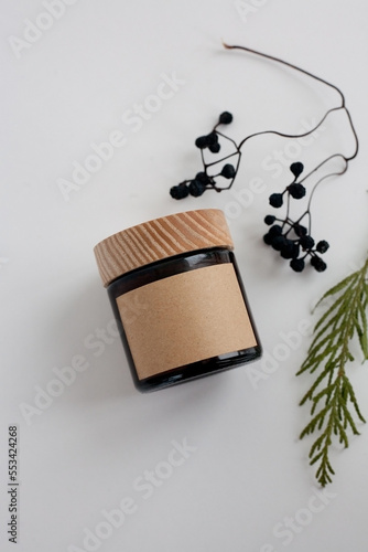 One cosmetic dark amber glass jar with kraft paper label, minimalism brand packaging mock up