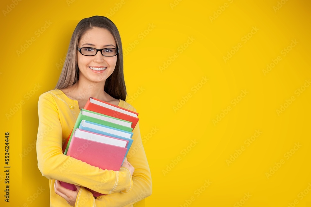 Young smart student with books, university concept Young smart student with books, university concept