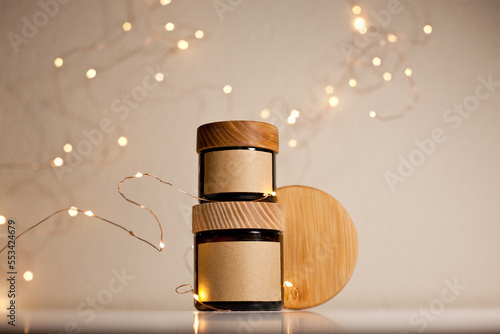 Two cosmetic dark amber glass jars with kraft paper label, minimalism brand packaging mock up