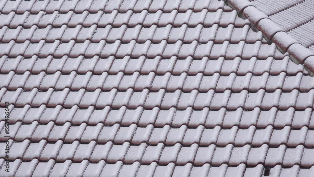 House rooftop tiles under snow in winter as background House rooftop tiles under snow in winter as background