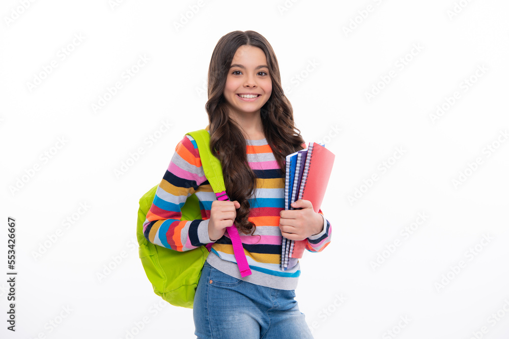 Back to school. Schoolgirl student with school bag backpack hold book on isolated studio background. School and education concept. Back to school. Schoolgirl student with school bag backpack hold book on isolated studio background. School and education concept.
