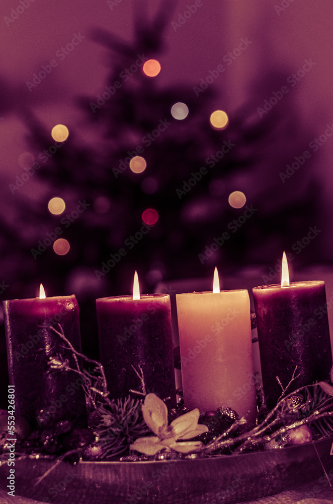 christian advent wreath with 4 burning candles