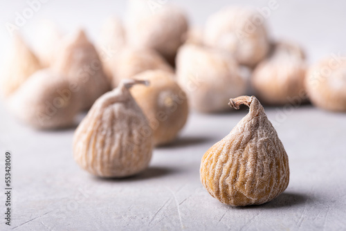 dried figs floured with rice flour. Selective focus on the foreground.