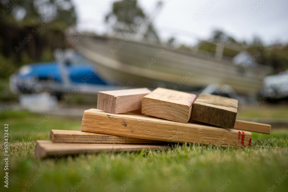 wood chocks for a caravan and camping. chocks behind a tyre. camping chocks for a boat trailer of travellers