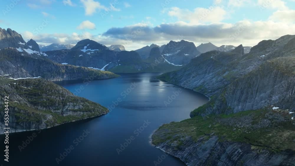 Aerial overview of a mountainous fjord in sunny summer day in Lofoten, Norway Aerial overview of a mountainous fjord in sunny summer day in Lofoten, Norway
