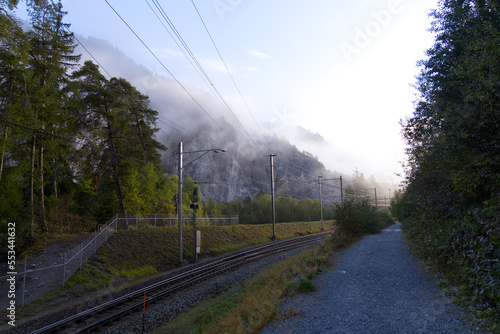 Cliff with cone of debris at canyon of Anterior Rhine Valley on a blue cloudy autumn morning at Versam, Canton Graubünden. Photo taken September 26th, 2022, Versam, Anterior Rhein valley, Switzerland. photo