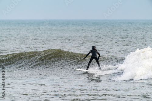 Female surfing the wave