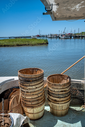 Chesapeake Bay fishing boat equiped with bushel baskets and net for catching blue crabs.