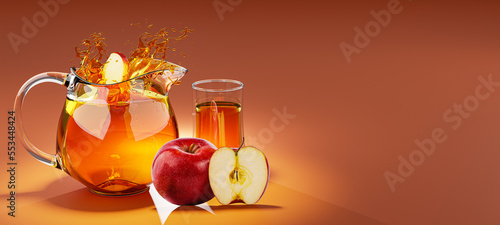 Half of an apple fruit dropped into a glass jug of apple juice making a splash