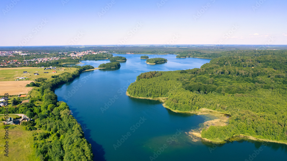 Aerial view of the forest on a sunny summer day. top down the drone. Poland near the city of Barlinek