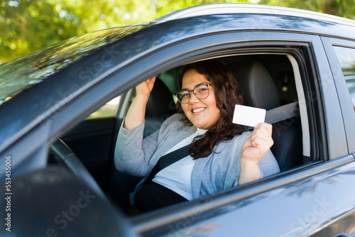 Beautiful big woman getting her driver's license looking excited