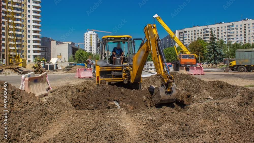 Industrial excavator diging ground and removing parts of old road timelapse on construction site. Preparation to reconstruction of tram tracks in a big city Industrial excavator diging ground and removing parts of old road timelapse on construction site. Preparation to reconstruction of tram tracks in a big city