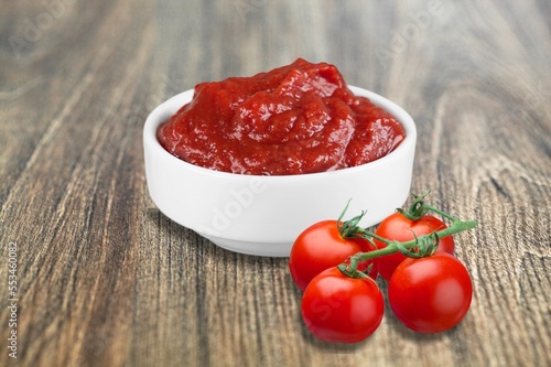 Ripe tasty fresh tomatoes and sauce.