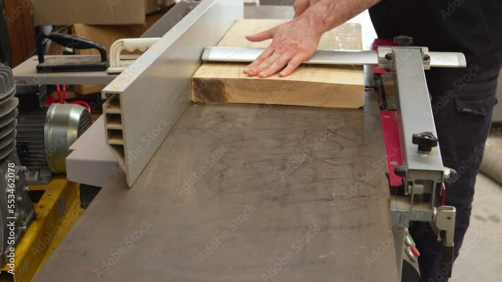 Flattening piece of Ash wood on jointer machine Flattening piece of Ash wood on jointer machine