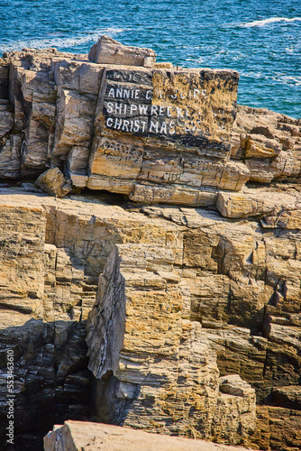 Annie C. Maguire shipwreck marker on Maine coastline photo