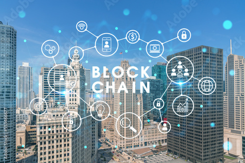 Aerial panorama city of Chicago downtown area and Lake, day time, Illinois, USA. Birds eye view, skyscrapers, financial district. Decentralized economy. Blockchain, cryptography concept, hologram