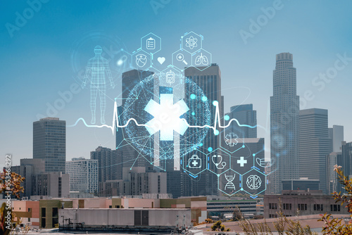 Los Angeles panorama skyline of downtown at day time, California, USA. Skyscrapers of LA city. Hologram healthcare digital medicine icons. The concept of treatment from disease, Threat of pandemic