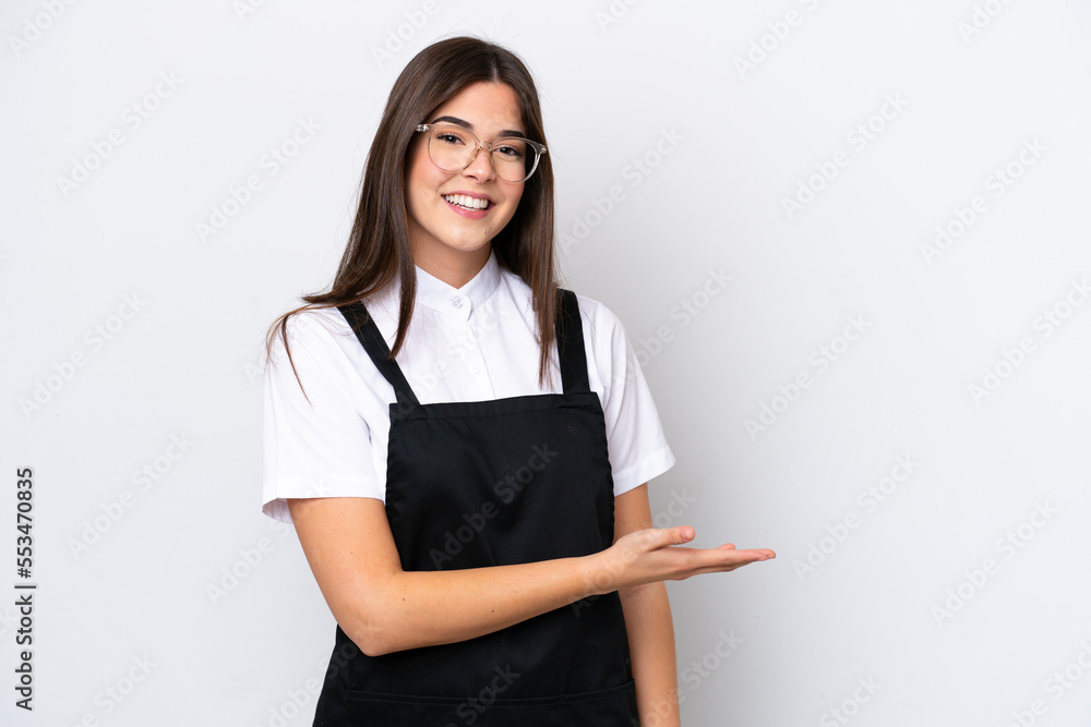 Restaurant Brazilian waiter woman isolated on white background presenting an idea while looking smiling towards Restaurant Brazilian waiter woman isolated on white background presenting an idea while looking smiling towards