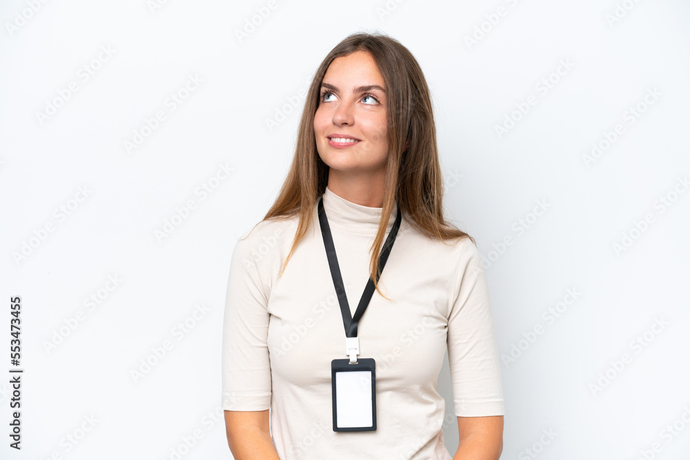 Young pretty woman with ID card isolated on white background thinking an idea while looking up Young pretty woman with ID card isolated on white background thinking an idea while looking up