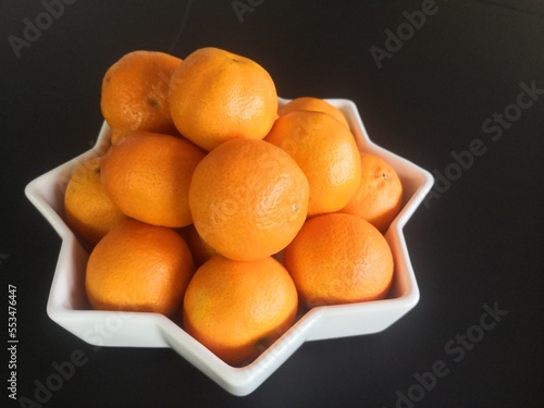 tangerines in star shaped bowl