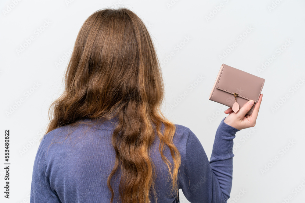 Young pretty woman holding wallet isolated on white background in back position Young pretty woman holding wallet isolated on white background in back position
