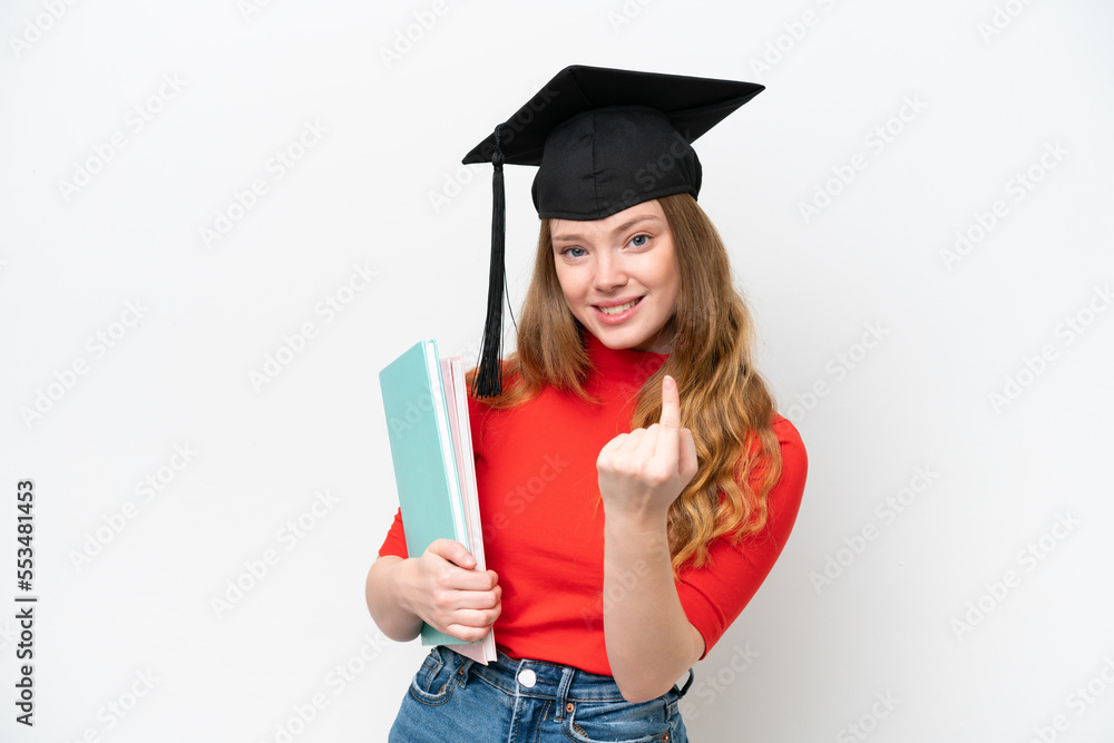 Young university graduate woman isolated on white background doing coming gesture Young university graduate woman isolated on white background doing coming gesture