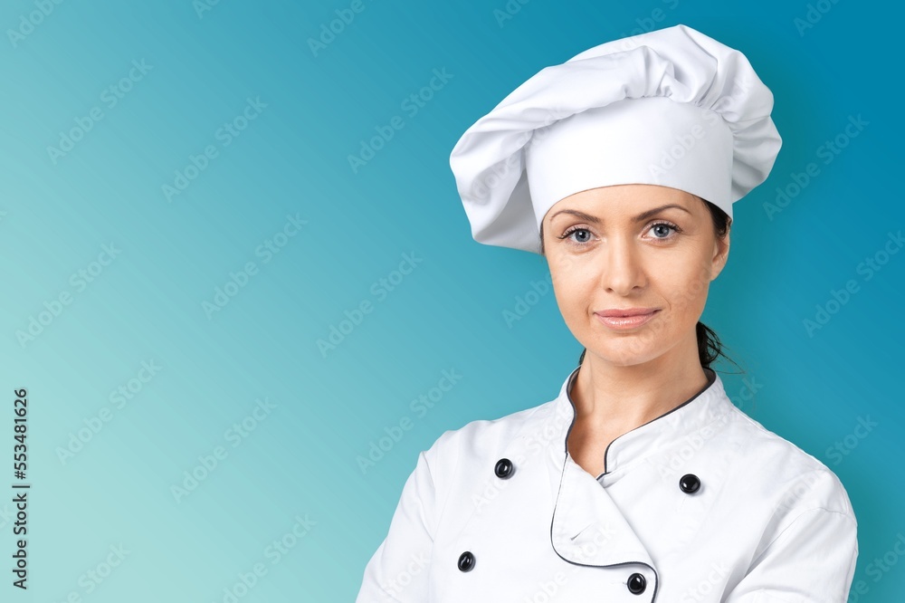 Smiling young Chef in Cooking Uniform Smiling young Chef in Cooking Uniform
