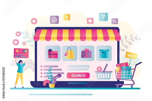 Internet shopping, e-commerce. Online store on laptop screen. Woman customer holds credit card and fills virtual shopping cart with goods. Making remote purchases.