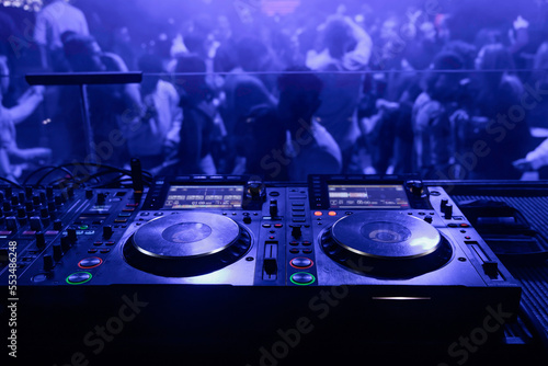dj table in the club and people in the background
