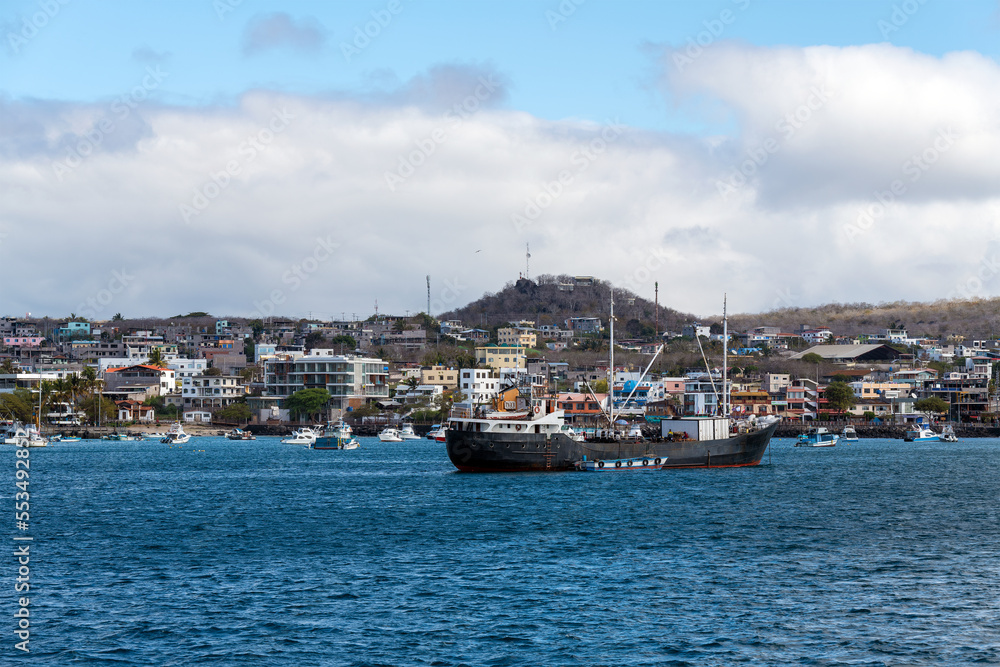Harbor with ships and cityscape of Puerto Baquerizo Moreno, Galapagos national park, Ecuador.